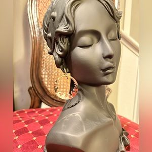 - Gold tone clip on hoops